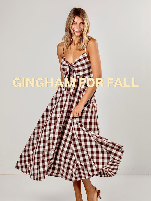Gingham, but make it FALL 🤎🍂 The print we’ll be wearing on repeat all season long! This dreamy dr...